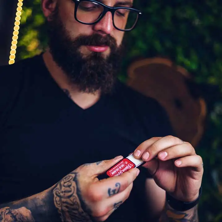 Applying Red solid cologne by Scissor Hands — a bold fragrance inspired by energy and strength.